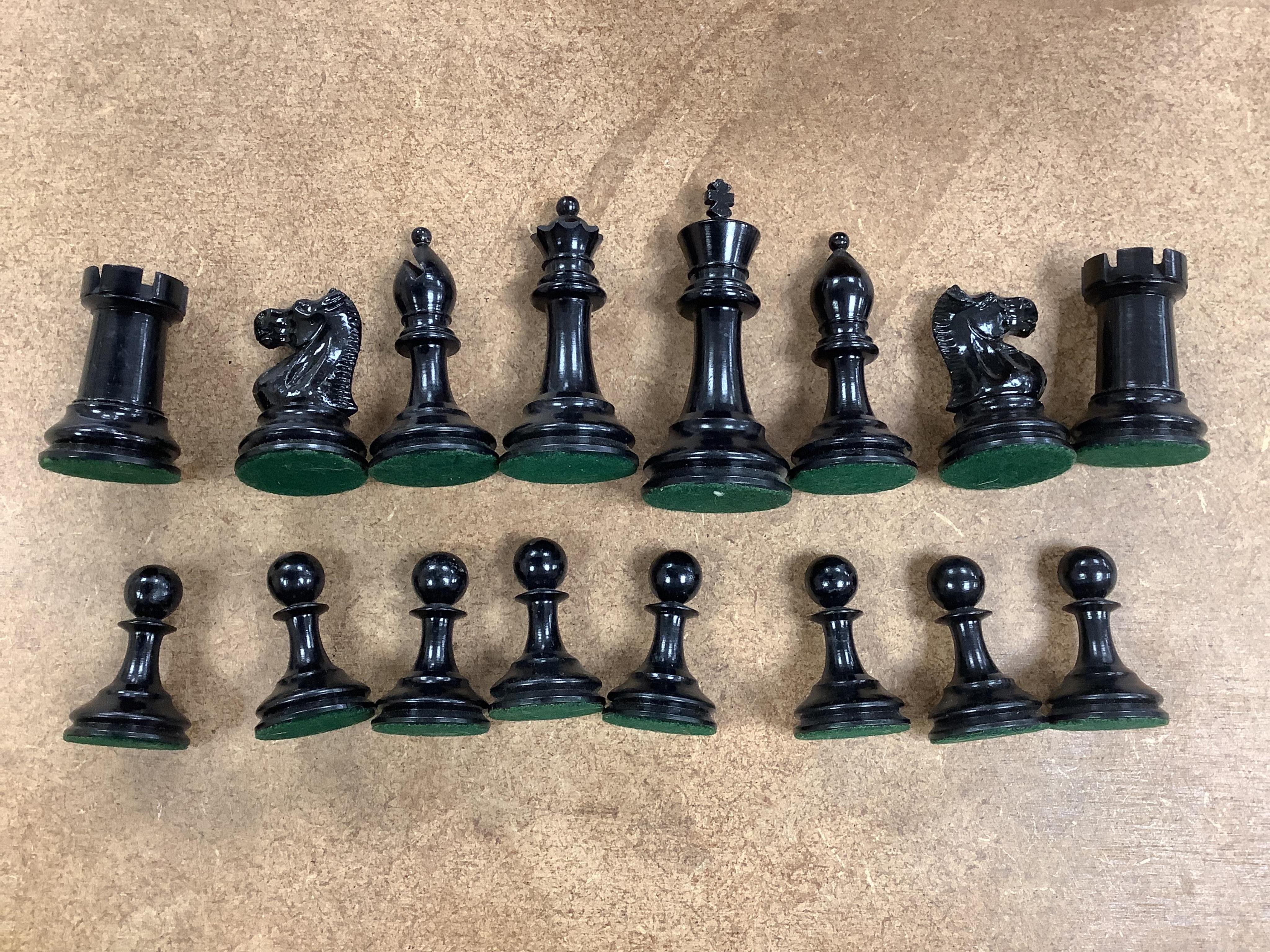 A turned wood and weighted Staunton pattern chess set, king 8cm tall. Condition - good and complete.